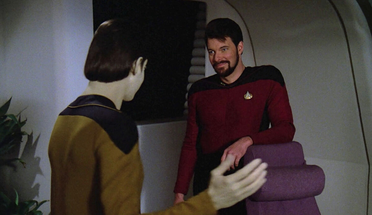 Data and Riker talking after the hearing.